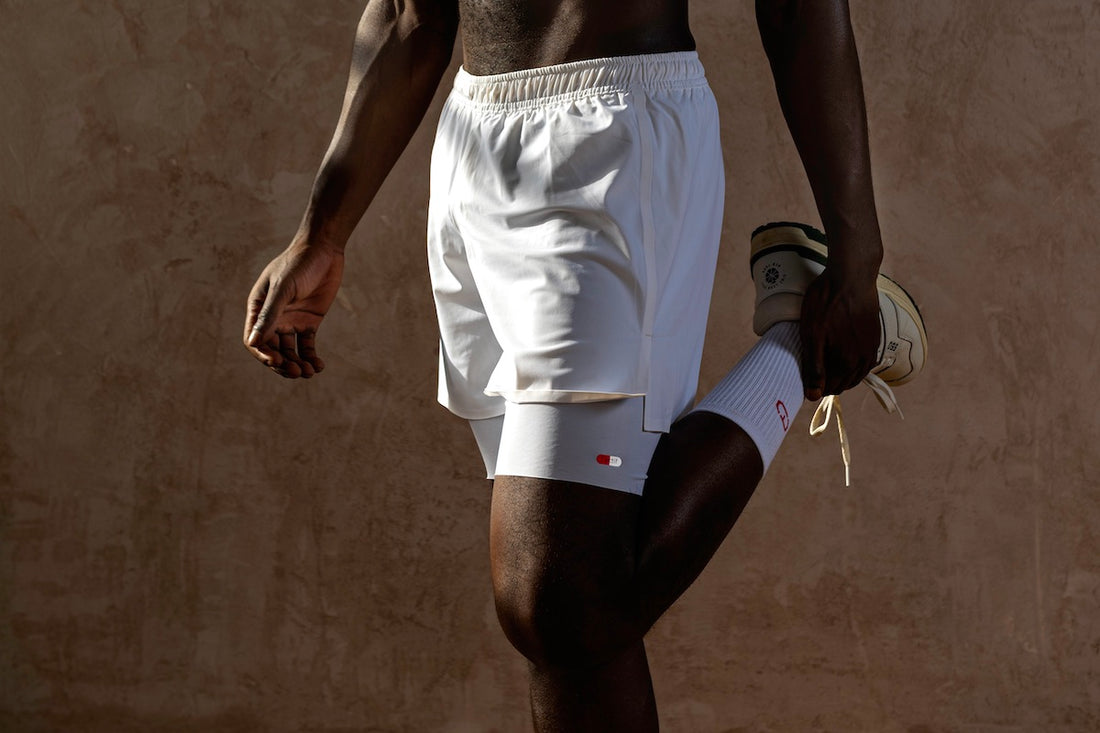 man wearing white running shorts