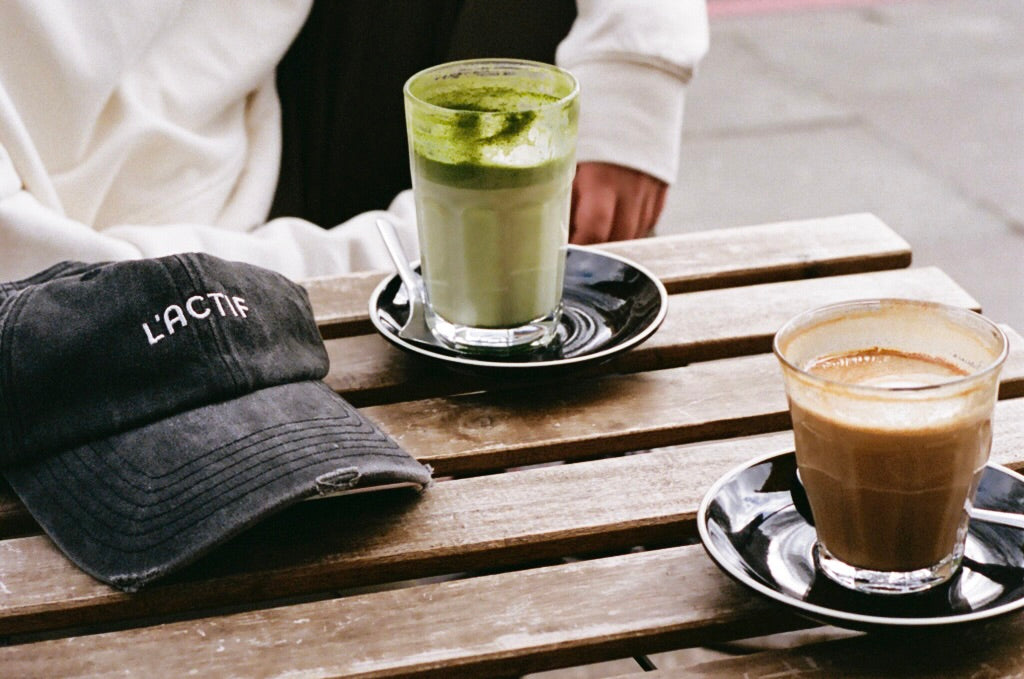 cap and lattes on table