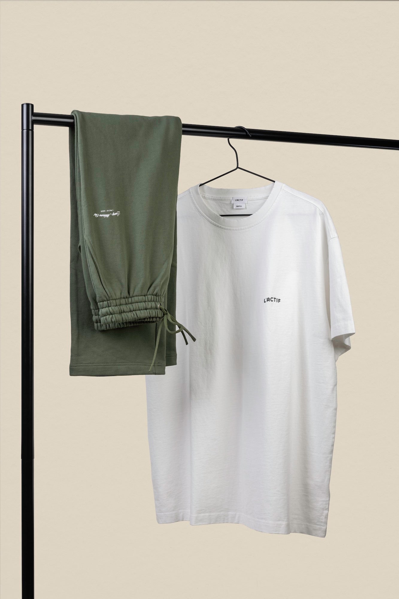 white tshirt and khaki pants on rack